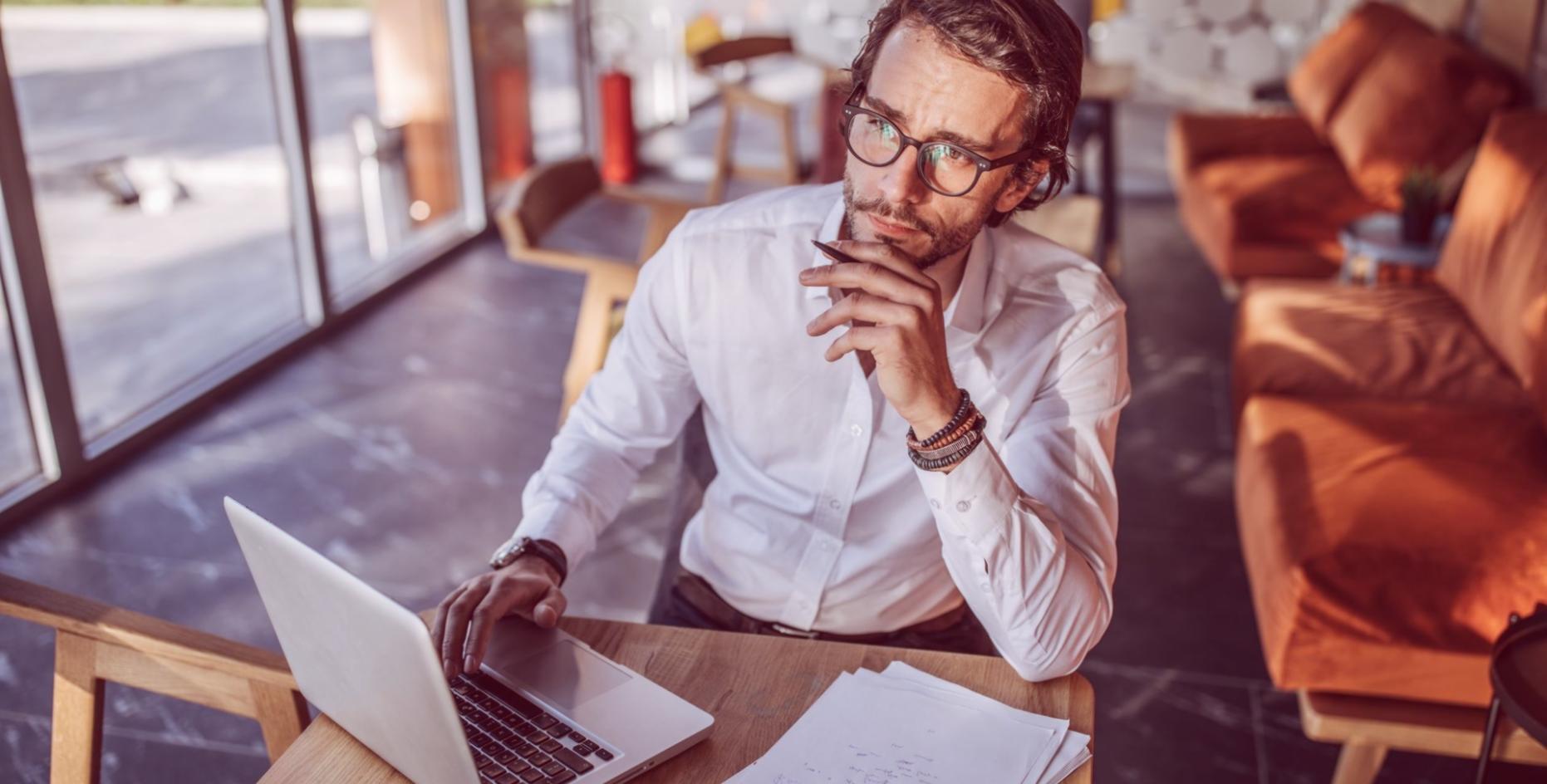 Financial planning workspace with documents and analysis materials